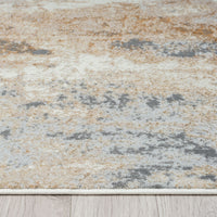 Textured area rug with a mix of beige, brown, and gray colors on a wooden floor.