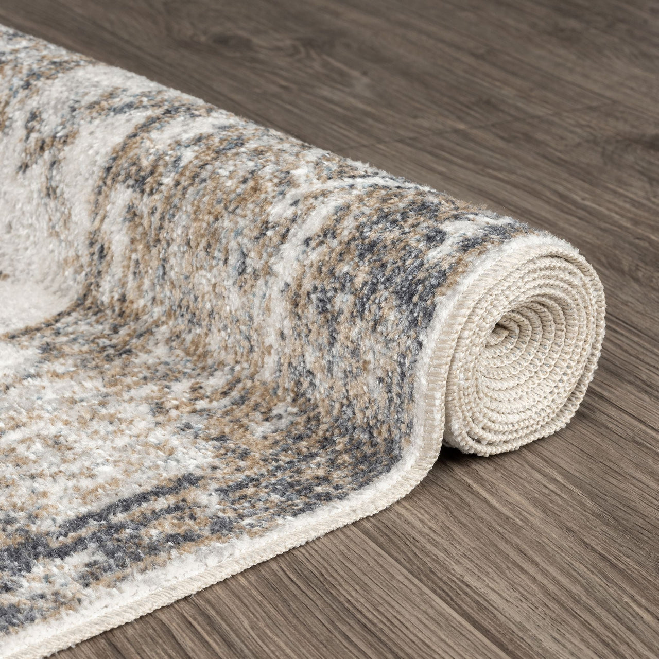 Rolled modern runner rug with neutral earth tones and subtle abstract pattern on wood floor.