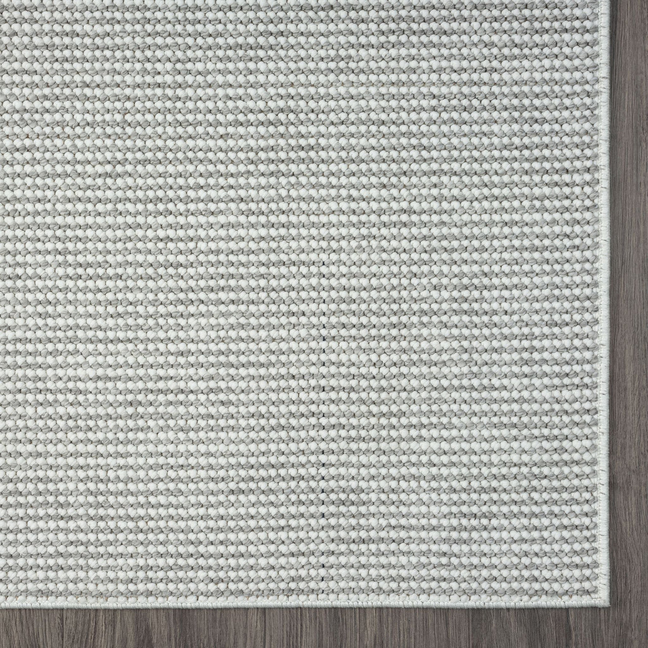 Silver grey flatweave rug with subtle textured geometric pattern and clean edges.