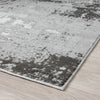 Gray and white textured area rug on a wooden floor