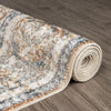 Rolled coral runner rug with abstract multi-colored pattern in gray, beige, and orange tones on hardwood floor.