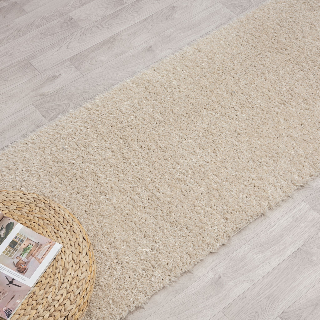 Beige modern shaggy runner rug with soft polyester fibers on light wood floor.