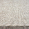Taupe flatweave rug with subtle textured geometric pattern and tightly woven polyester fibers.
