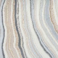 Close-up of textured fabric with wavy pattern in neutral colors
