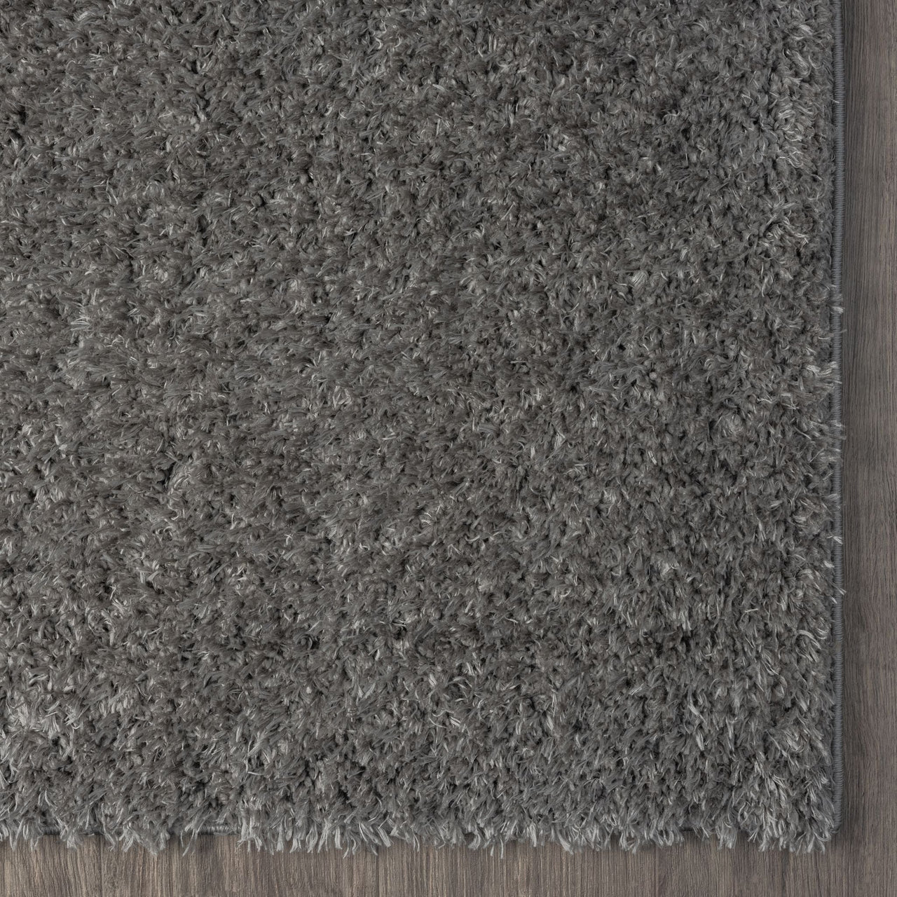 Grey and silver modern shaggy rug with plush polyester fibers and clean edges.