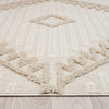 Taupe and beige runner rug with textured geometric diamond and zigzag patterns and fringe edges on light wood floor.