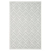 White modern rug with raised geometric diamond pattern and textured pile.
