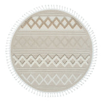Round beige and cream rug with geometric diamond patterns and fringed edges.