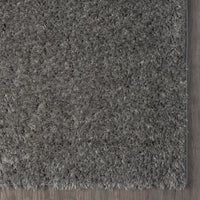 Grey and silver modern shaggy runner rug with thick plush polyester fibers and a soft texture.