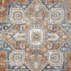 Modern transitional rug with geometric floral pattern in blue, orange, and beige tones.