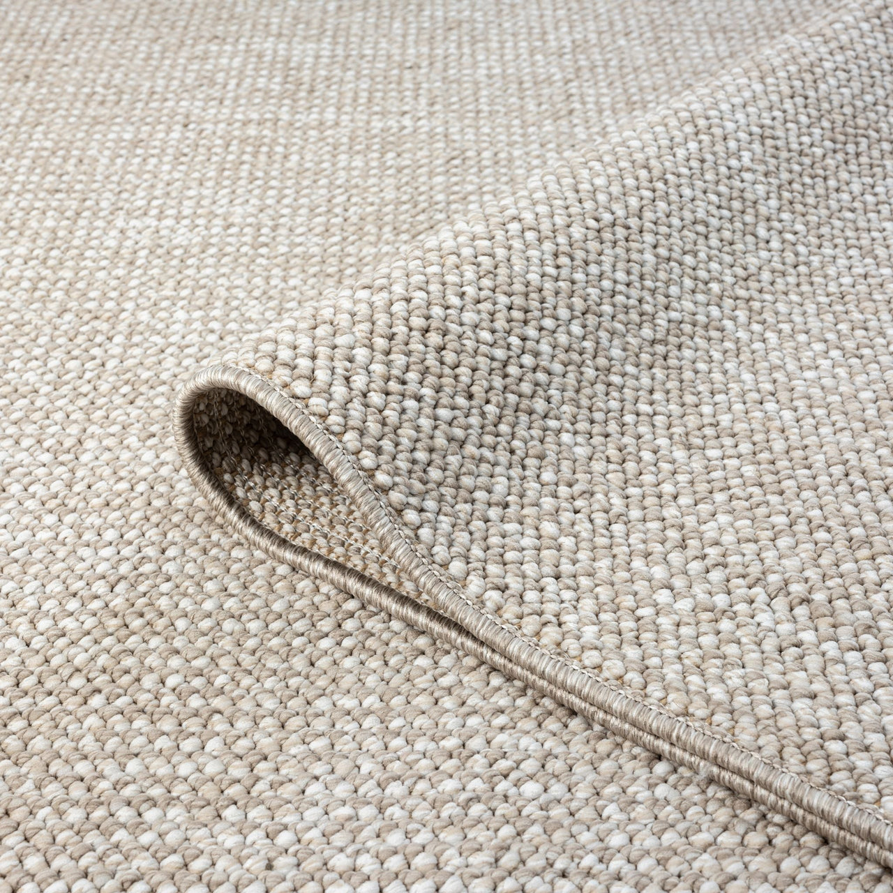 Taupe flatweave rug with tight, textured geometric weave in neutral tones.