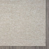 Taupe flatweave runner rug with subtle textured geometric pattern and solid darker border.