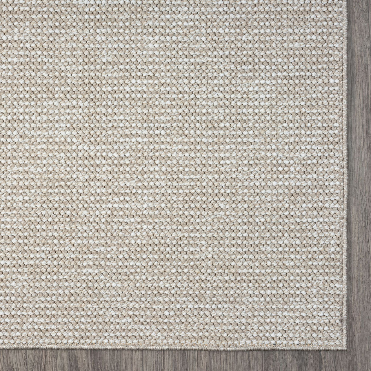 Taupe flatweave runner rug with subtle textured geometric pattern and solid darker border.