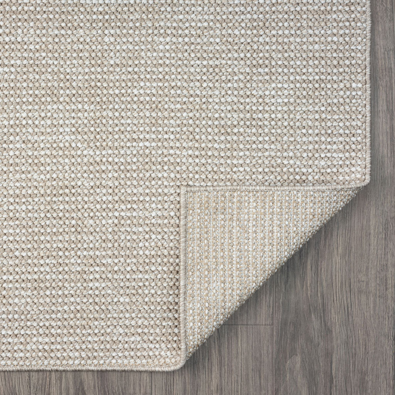 Taupe flatweave runner rug with subtle geometric texture on wood floor.