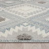 Grey and cream runner rug with textured geometric pattern and fringed edges.