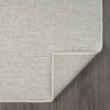 Beige flatweave runner rug with subtle geometric texture and clean stitched edges on dark wood floor.