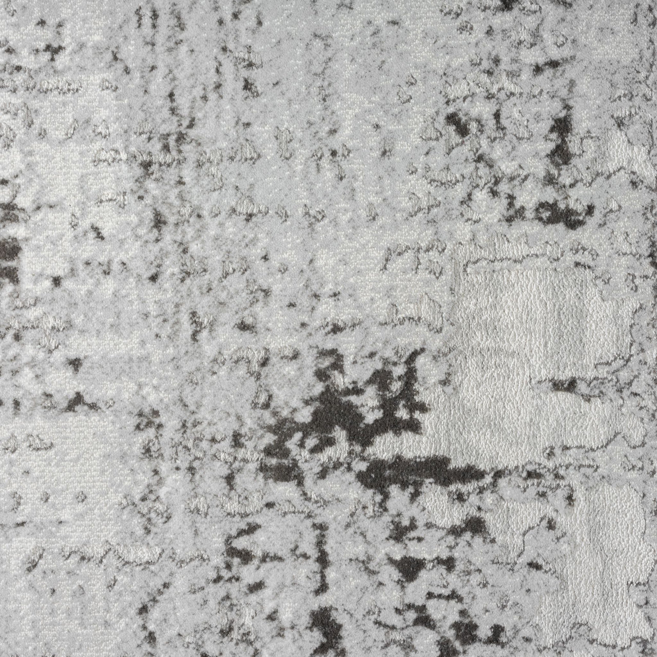 Close-up of a gray and black abstract modern rug