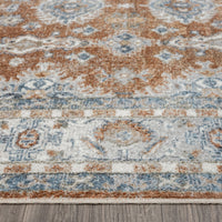 Multicolor modern runner rug with intricate geometric and floral motifs on soft beige, blue, and rust tones.