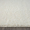 Cream-colored modern shaggy runner rug with soft, plush polyester fibers and thick pile texture.