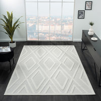 Grey and white geometric patterned modern rug with textured diamond design.