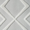 White runner rug with raised geometric diamond patterns and a textured polypropylene pile.
