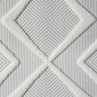 White runner rug with raised geometric diamond patterns and a textured polypropylene pile.