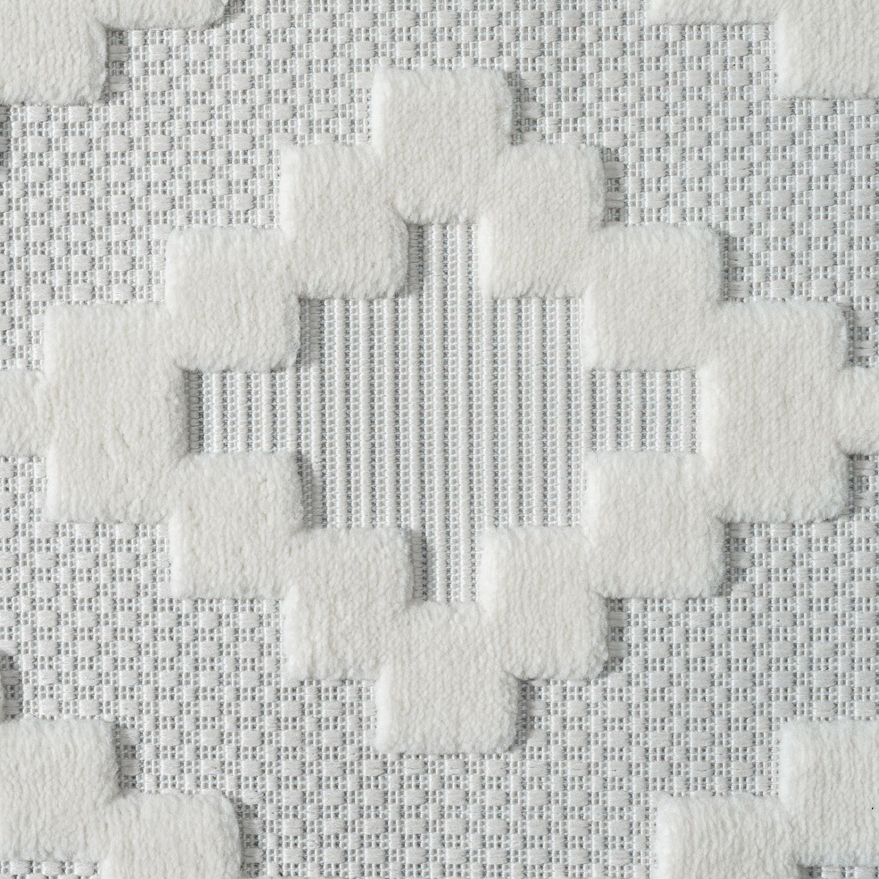 Cream runner rug with textured geometric pattern and subtle striped background.