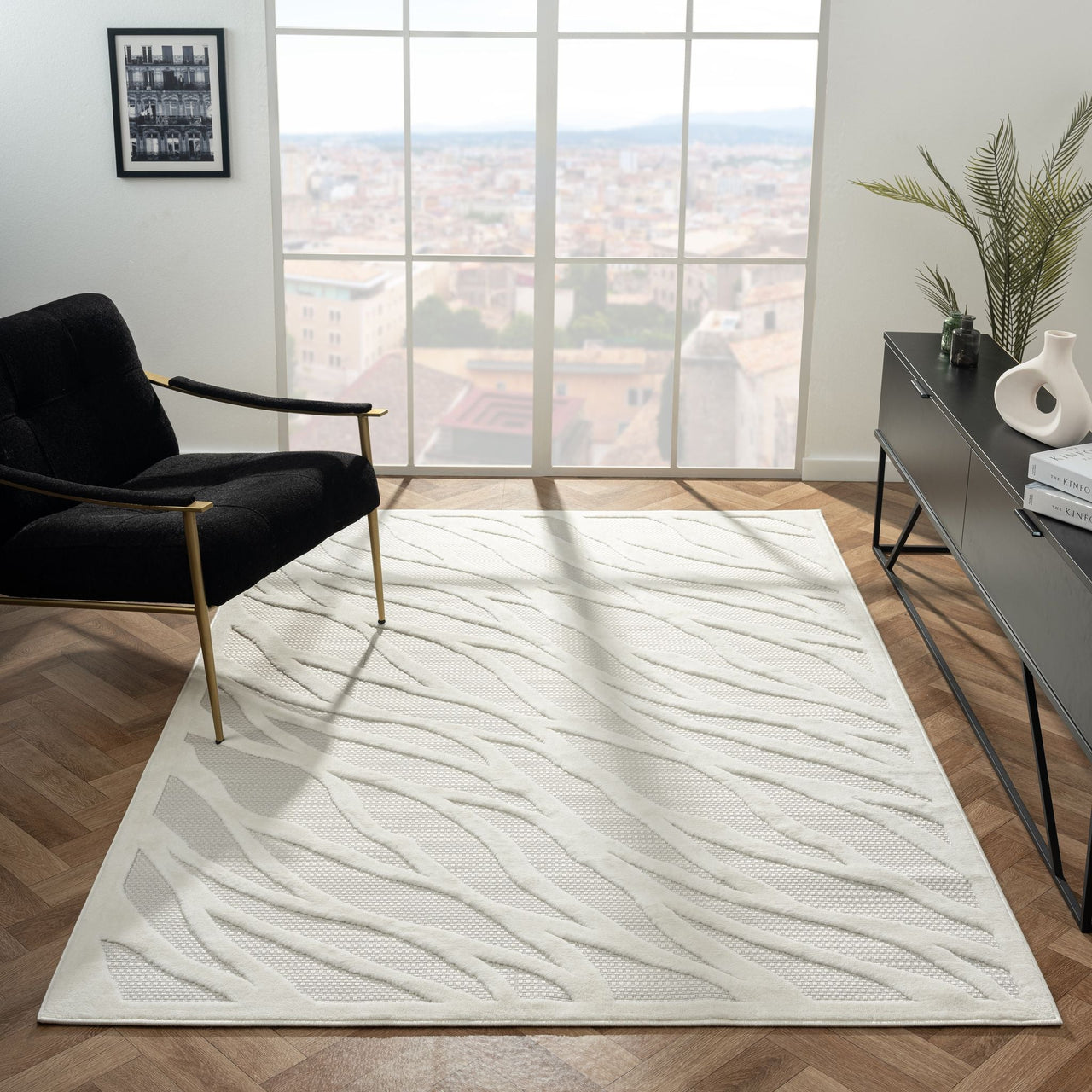 Ivory modern rug with subtle textured geometric wave pattern on polypropylene pile.