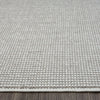 Grey flatweave runner rug with subtle textured geometric pattern and clean edge stitching.