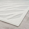 Ivory modern rug with textured geometric pattern on light neutral background.