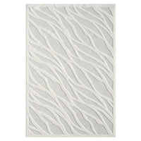 Ivory rug with textured geometric wave pattern in soft neutral tones.