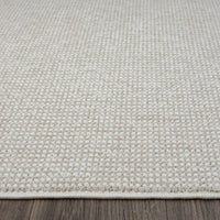 Beige flatweave runner rug with subtle textured geometric pattern and clean edges on wooden floor.