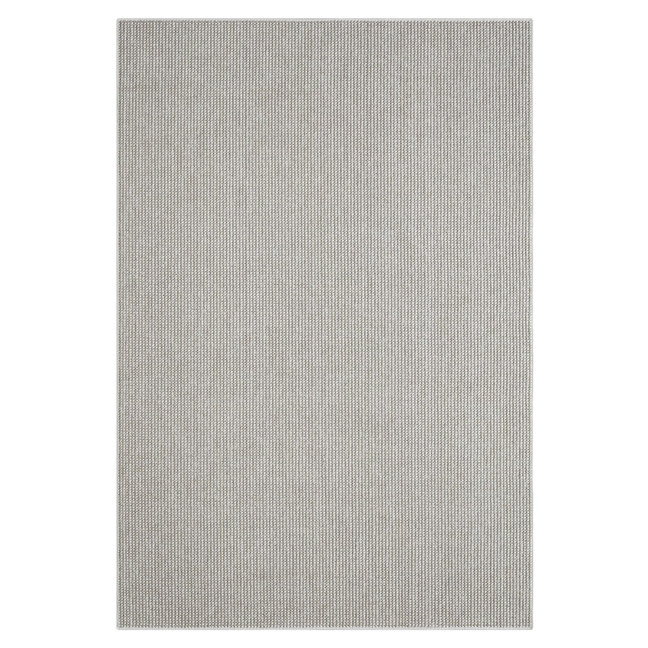 Beige flatweave rug with subtle geometric pattern and textured modern design.