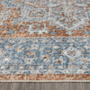 Blue, rust, and cream transitional rug with intricate geometric and floral patterns, low pile.