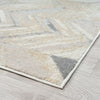 Modern runner rug with abstract geometric pattern in beige, gray, and cream tones on light flooring.