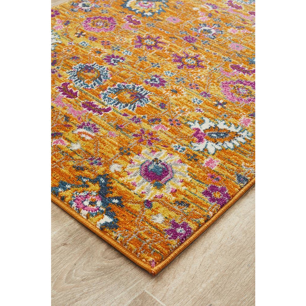 Rust pink and multi-color transitional bohemian runner rug with floral and geometric patterns.