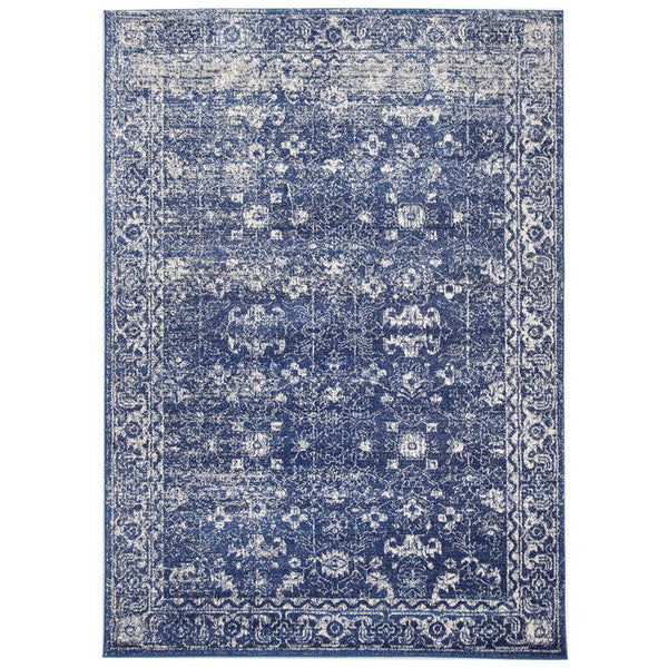 Navy blue transitional rug with intricate white floral and geometric patterns, power-loomed polypropylene.