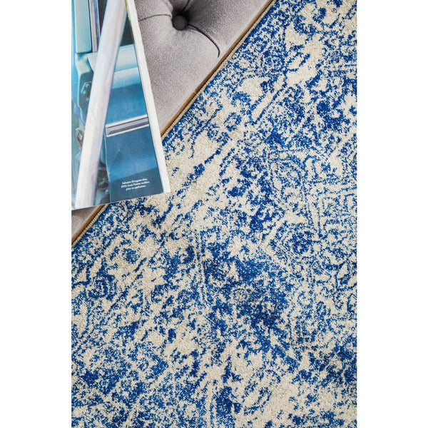 Navy and white patterned transitional runner rug with distressed design and soft texture.