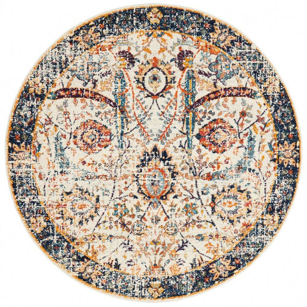 Round transitional rug with ivory base, intricate navy border, and multi-colored floral patterns.