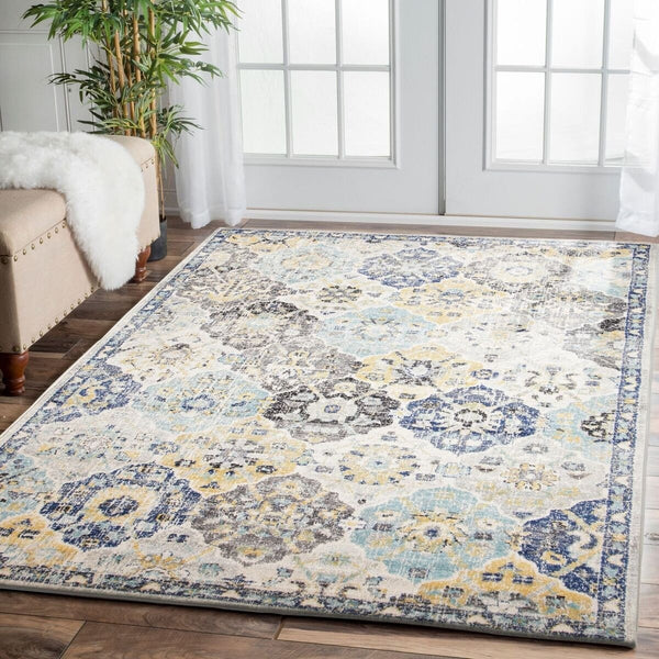 Multi-color Minsk rug with intricate transitional floral and geometric patterns in blue, yellow, and gray tones.