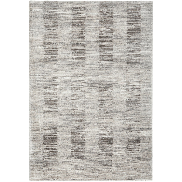 Steel grey shag rug with modern striped pattern in varying shades of grey and textured pile.