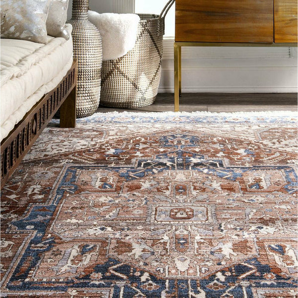 Traditional Khonsu 441 rug with intricate blue, brown, and beige patterns on polyester fiber in a rectangular shape.