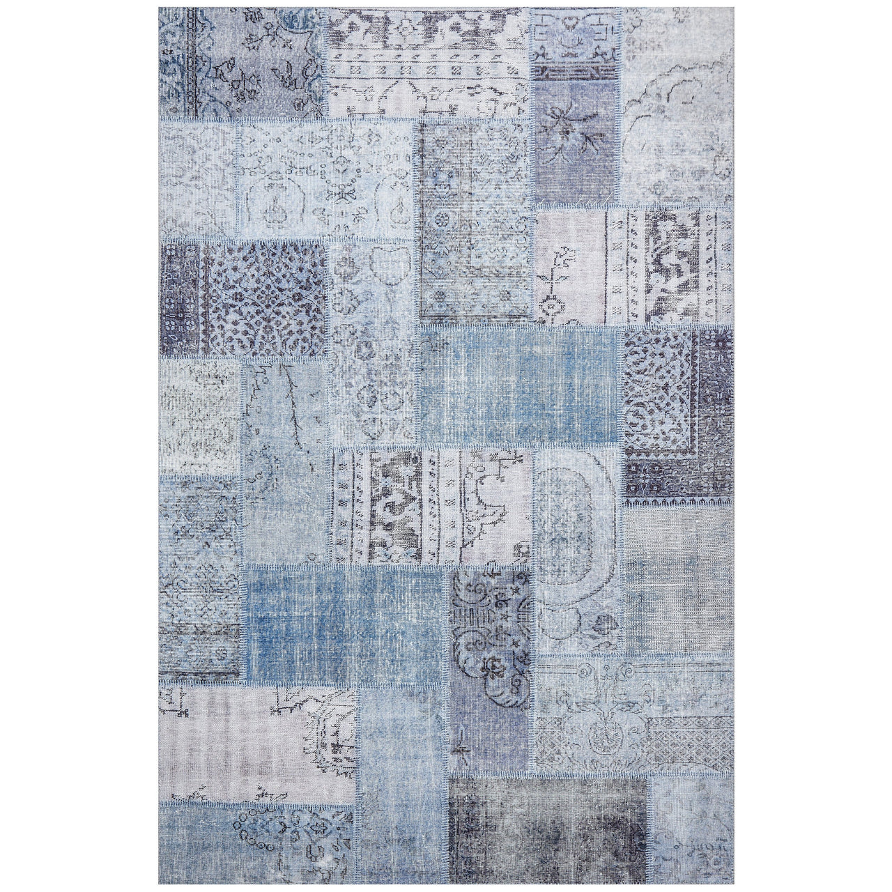 Rectangular transitional rug with blue denim patchwork and intricate patterned designs in varying shades of blue and gray.