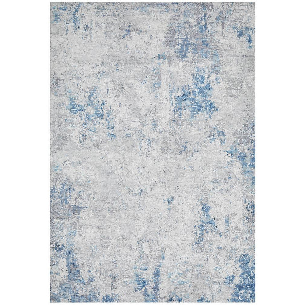 Blue grey and beige transitional rug with abstract distressed pattern and soft polyester pile.