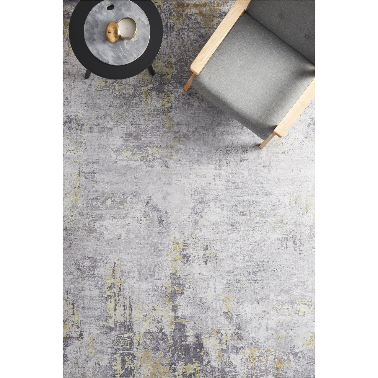 Transitional grey rug with subtle gold distressed pattern, low-pile polyester weave.