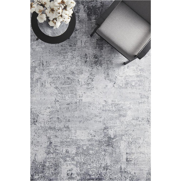 Silver grey transitional rug with subtle abstract pattern and soft texture.