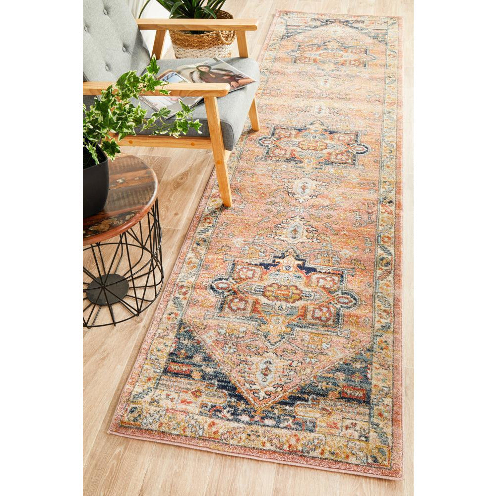 Multicolor transitional runner rug with tribal-inspired geometric patterns in warm earthy tones.