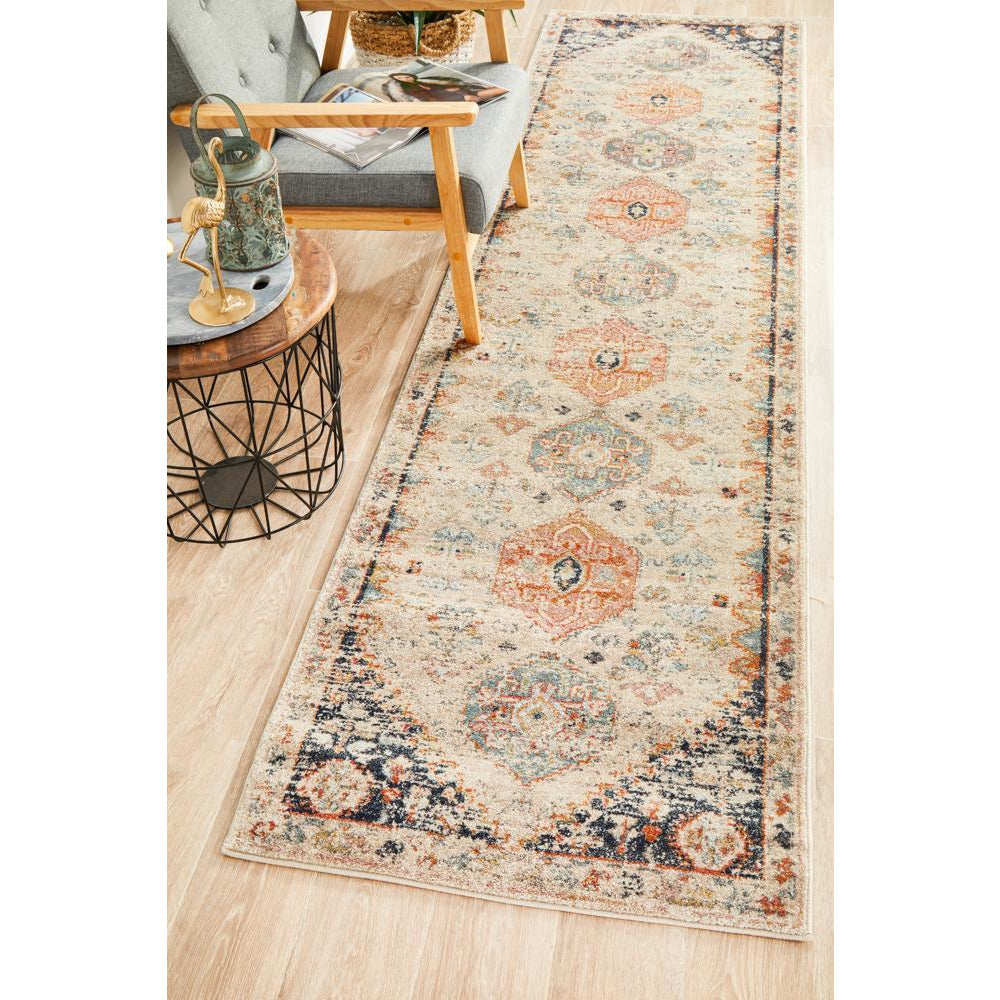 Multi-colored transitional runner rug with autumn tones, tribal-inspired geometric patterns, and a soft textured weave.