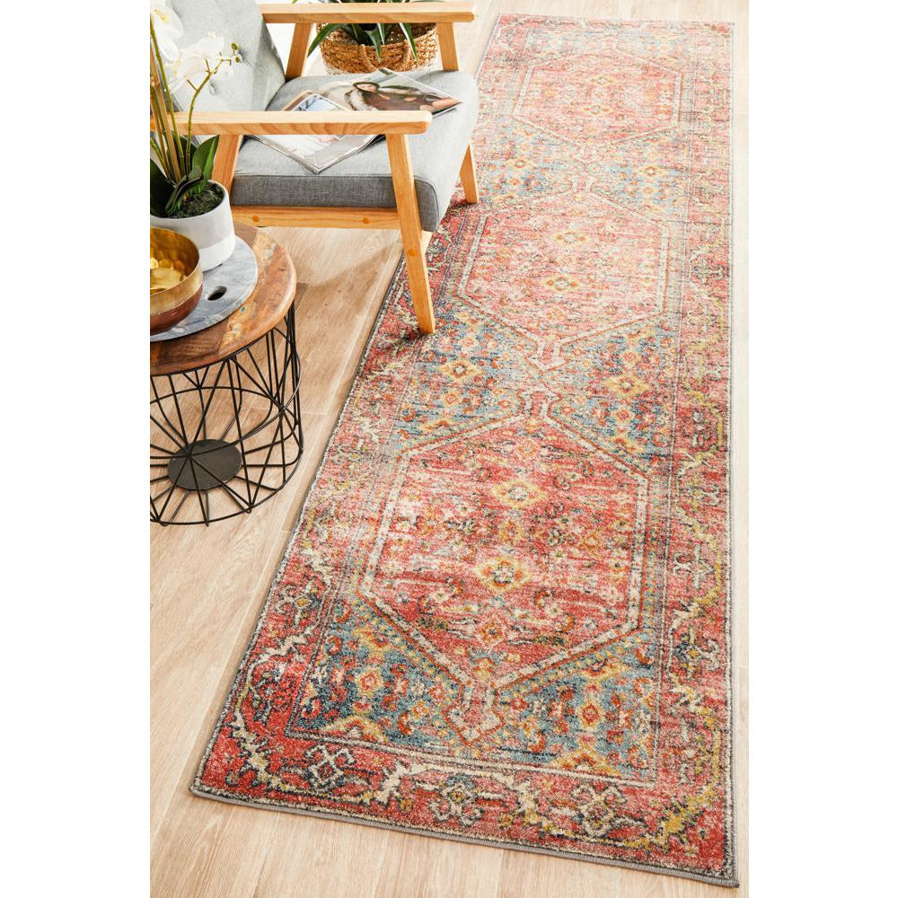 Crimson multi-color transitional runner rug with tribal patterns in a bohemian style.