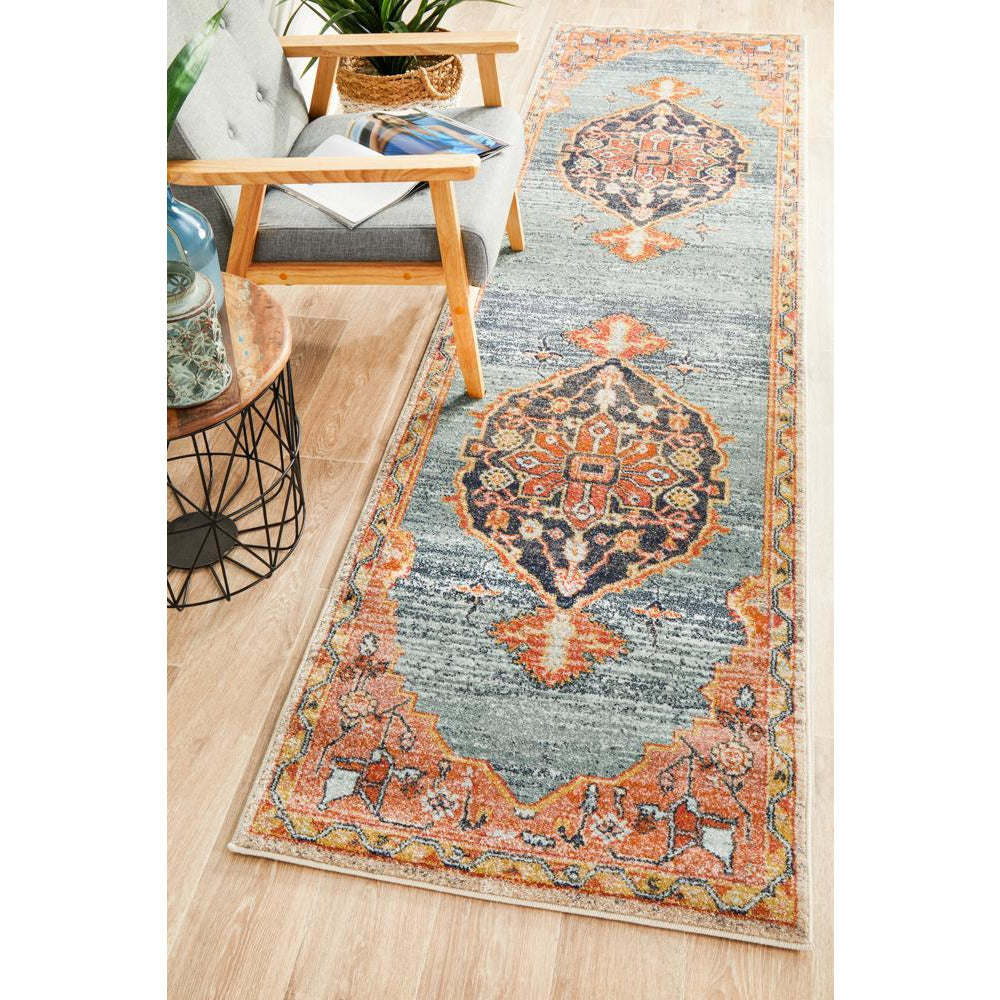 Blue and rust multi-color transitional runner rug with intricate tribal patterns and decorative border.
